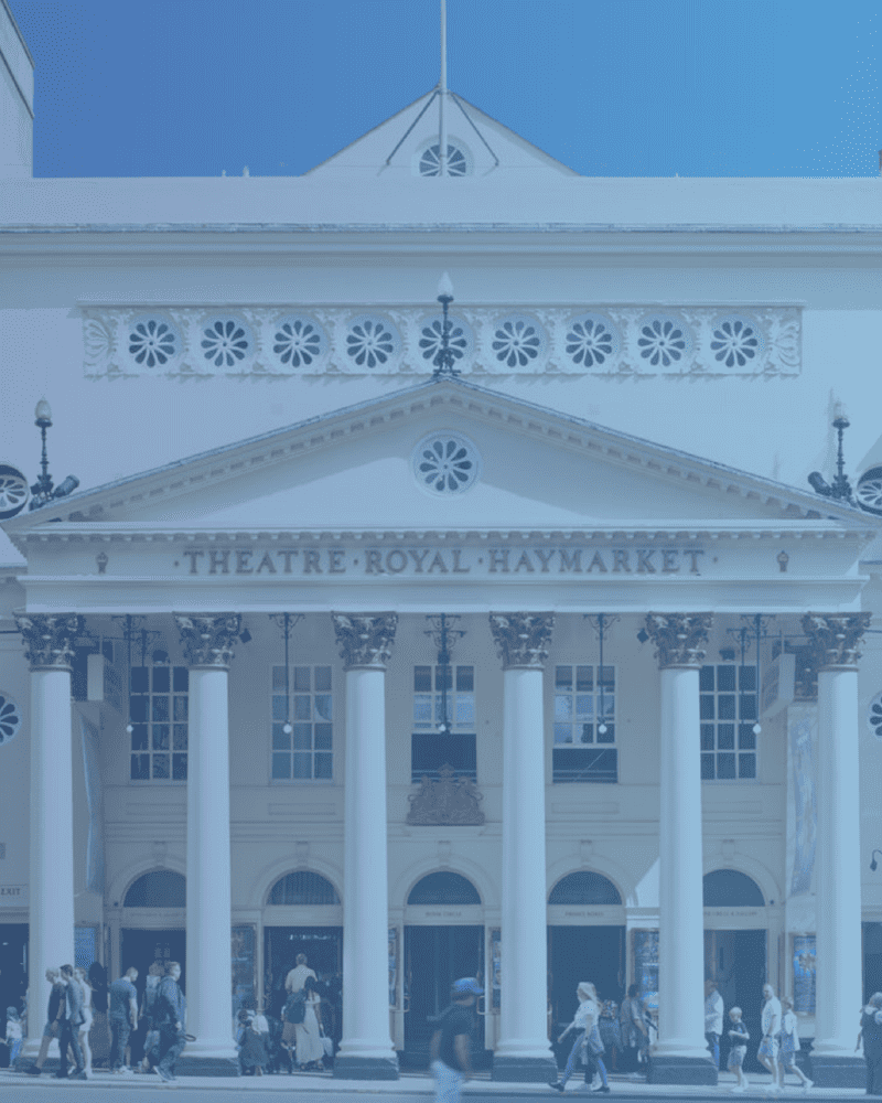 A photo of the Theatre Royal Haymarket. With white title of 'Paid Internship, Junior Theatre Technician' overlaid.